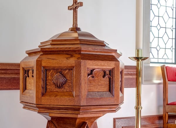 closeup of detail on baptismal font woodworking