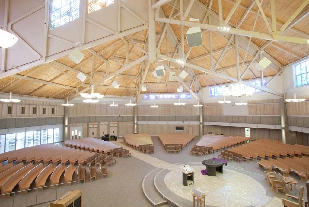 Wide view of church interior including rafters