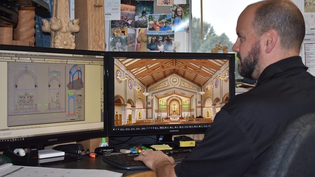 designer sitting at computer 