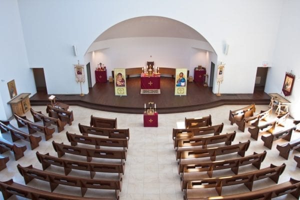 St. Joseph’s Ukrainian Catholic Church in Ontario, Canada, uses radius curved pews to add seating to their small worship space.