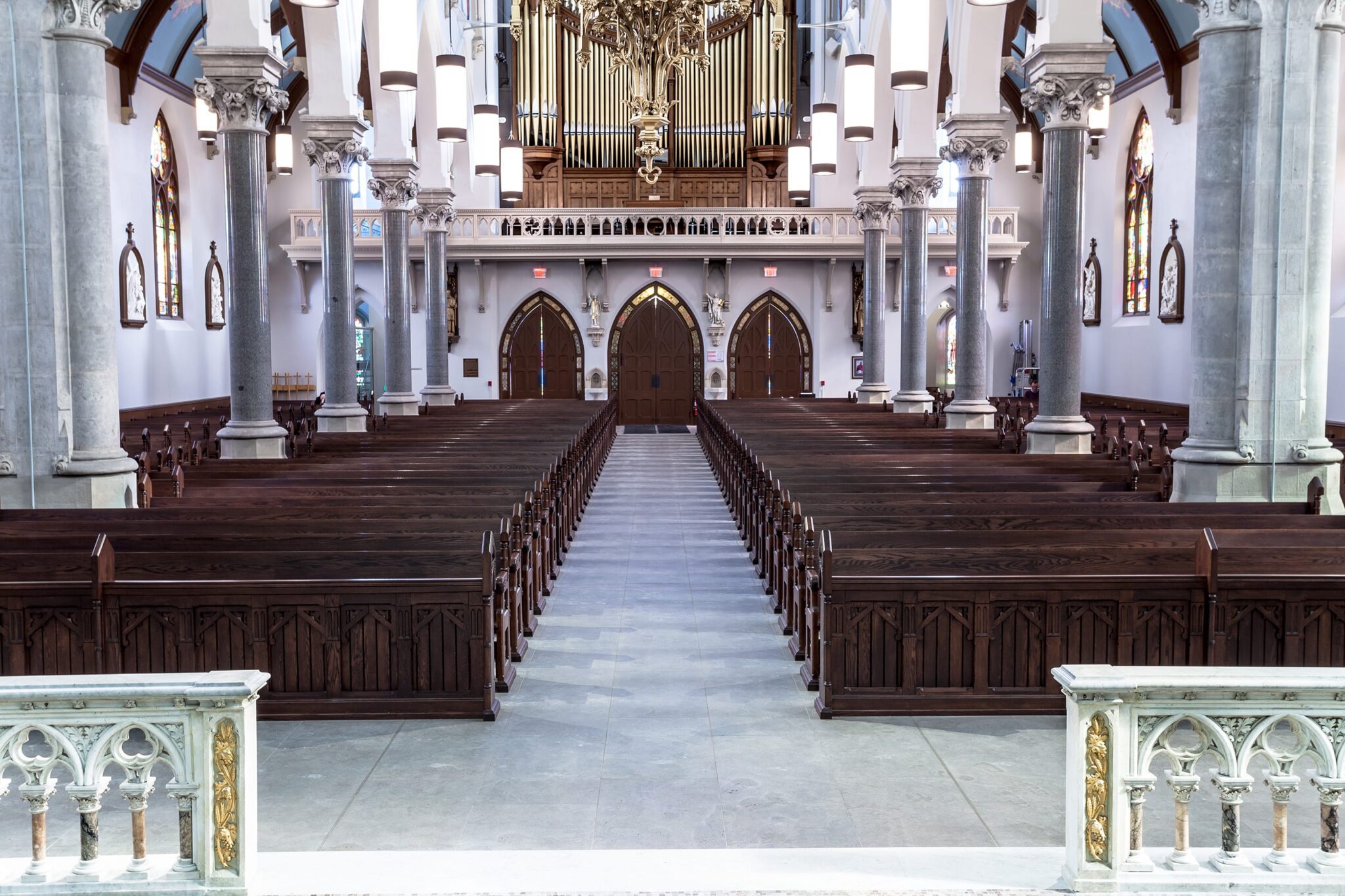 interior walkway with pews in rows