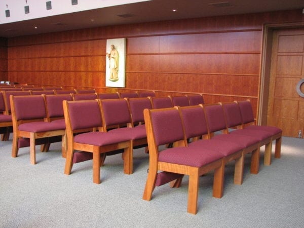 St. Joseph’s College High School Chapel in Washington, DC, use stackable wood chairs for space flexibility.