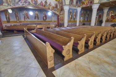 Church pews at a Greek Orthodox Church.
