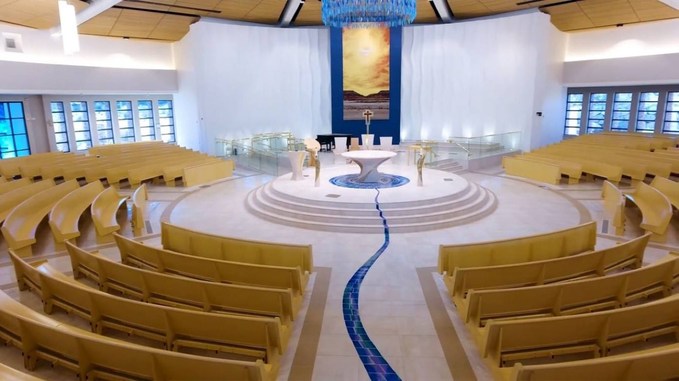 Rows of Radius Curved Pews in a modern church sanctuary