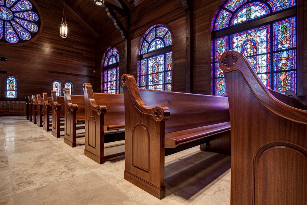 Recently disinfected, clean church pews awaiting a congregation’s arrival