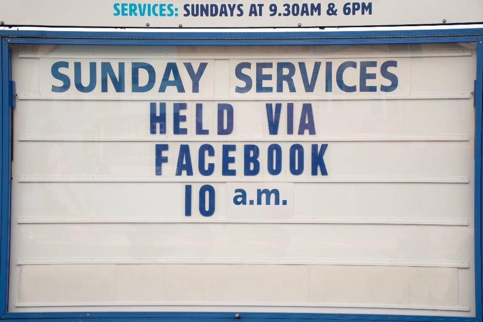 Church sign advertising online Sunday service via Facebook due to COVID-19