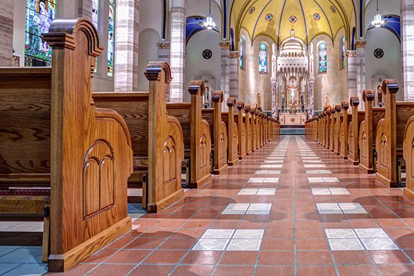 Straight wooden church pews provide a traditional look for the Basilica of St. Adalbert.