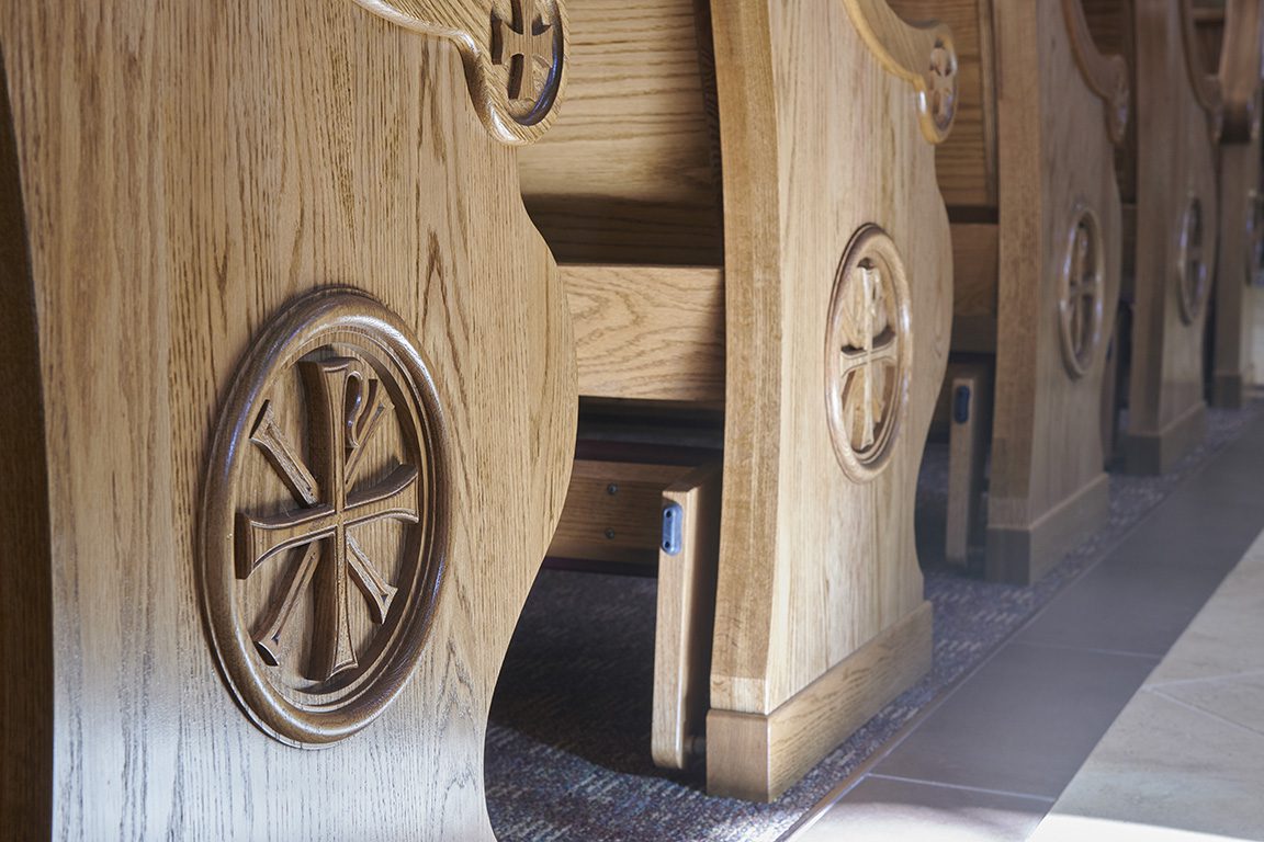 Custom edge-cut designs of pew ends at St. Sophia Greek Orthodox Church.