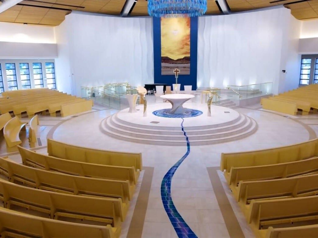 Rows of Radius Curved Pews in a modern church sanctuary