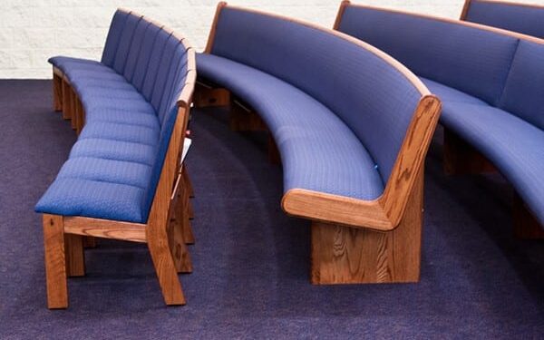 Church pews and church covered in upholstery fabric.
