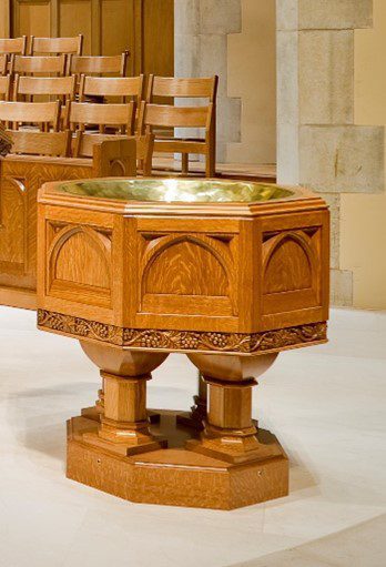 A baptismal font made from wood.