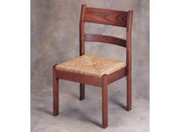 A medium-tone brown chair with a woven seat.