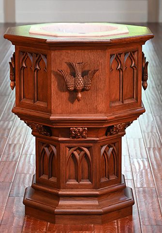 carved wooden baptismal font